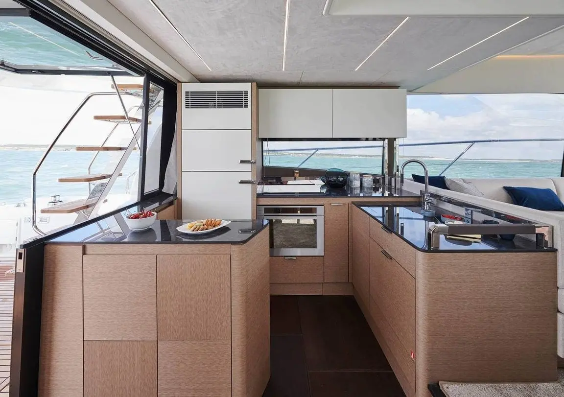 Prestige 590 Fly, flybridge — Luxury Yacht Sardinia, Sardinia. Flybridge comfort for calm Costa Smeralda days